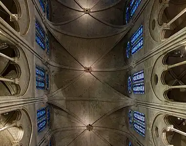 Early six-part rib vaults of the nave. The ribs transferred the thrust of the weight of the roof downward and outwards to the pillars and the supporting buttresses.