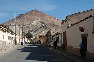 A street in Potosí with Cerro Rico in the background.