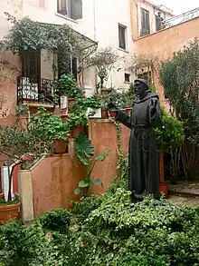 Statue of Francis of Assisi outside the Catholic church of Chania