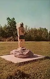 Statue of Roy Oshkosh, Menominee chief and Egg harbor resident during the time the statue was standing in Murphy Park