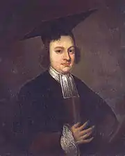 Half length and dark portrait of a serious and slightly plump man wearing a black academic gown with white collar, ruffled cuff, and a large mortarboard.