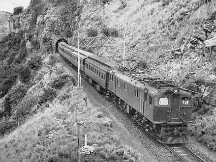 Class 3E exiting the tunnel between New Formosa and New Beacon Hill stations on the old 1918 Mooirivier-Estcourt deviation, abandoned c. 1957