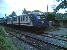 Class S10 stopping at Batuwaththe on a rainy morning