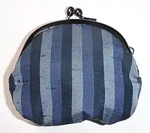 Coin purse. The thicker portions of yarn visible in the weave are called slubs.