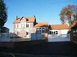 The town hall and echool in Courtemanche