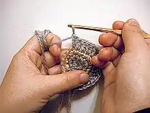 Most crochet uses one hook and works upon one stitch at a time.  Crochet may be worked in circular rounds without any specialized tools, as shown here.