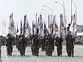 Flag Carriers of the Cypriot National Guard marching in formation during the Independence day parade