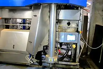 An automatic milking system milking a cow.