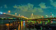 The Daishi Bridge over the Tama River. The Yokohane Route is carried by the bridges on the left. While Tonomachi-dōri is carried by the bridges on the right