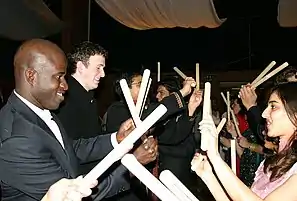 Tourists playing Dandiya Raas