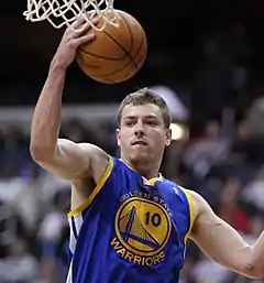 David Lee is with the Golden State Warriors in air with a ball in hand