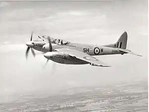 An inflight image of a twin-engined monoplane aircraft