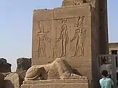 Entrance gate to the temple, with bas-relief and sphinx