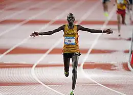 Dismas Yeko of Uganda crosses the finish line during the men's 10,000m final at the 31st FISU Summer World University Games in Chengdu, China.