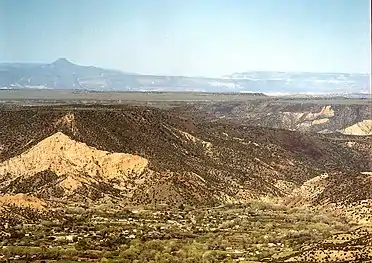 Dixon, New Mexico.  View looking west. Cerro Pedernal is the flat peak on the horizon left.