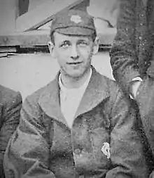 Monochrome photograph of Priestley dressed in Tewkesbury Cricket Club colours and cap.