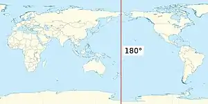 A map of the Earth with the Pacific Ocean in the centre, with a vertical red line running the full height just west of the Bering Strait and east of New Zealand.