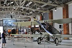 L'Envol des pionniers: a Salmson 2 A.2 plane is exposed under a portrait of Antoine de Saint-Exupéry.