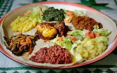 Image 10A plate of Injera with various Eritrean stews (from Culture of Eritrea)