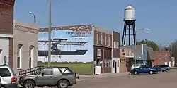 Downtown Ewing, with mural commemorating the Savidge brothers, early Nebraska aviators