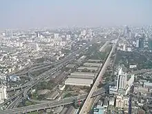 A view east from the observation platform of Bangkok's Bayoke tower showing Airport Rail link