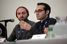 Photograph of Rafi and Benny fine sitting at a table