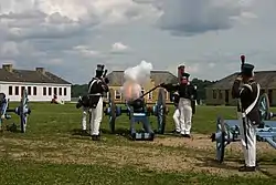 Minnesota Historical Society Historic Interpreters firing a cannon at the fort.