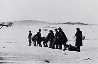 A White firing squad executes Red prisoners (photo taken by Harald Netvig).