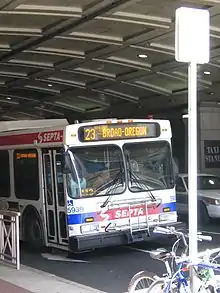 A New Flyer D40LF Route 23 bus passing under the Pennsylvania Convention Center arcade in 2006