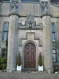 The main entrance to the mansion is a Tudor style porch