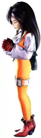 Garnet has long black hair and light skin. She wears white and orange, as well as brown boots and gloves. She is pictures with her hands together, eyes closed, and head turned downward while standing.