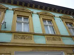 Detail of window pediments and cartouches