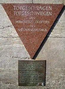 In the Berlin Nollendorfplatz subway station, a pink triangle plaque honors gay male victims.^