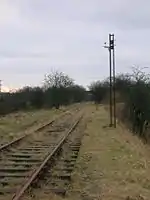 The line and old signal running towards Giffen station