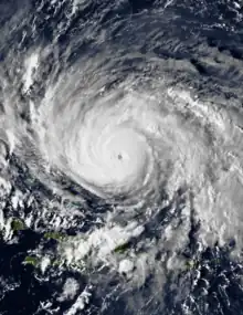 GOES-6 imagery of Hurricane Gloria near peak intensity on September 25. The intense storm features a small eye and large convective bands.