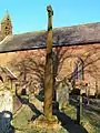 View of the Viking Cross and church, from the SW