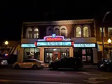 A nighttime photo of the exterior of the Grandin Theatre taken in 2023