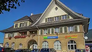 Three-story station building with gabled roof