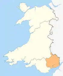 A map of Wales in yellow with a small area in green (about 5%) at the bottom right (south east)