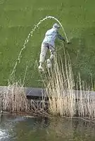 Tourism  statue in Madurodam, Netherlands, of the nameless boy plugging a dike