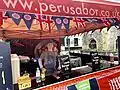 A market trader in their stall ready for service at St Albans Market.