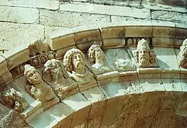 Decorated arch with faces