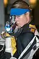 Hattie Johnson aiming her air rifle. She competed in the women's 10 m Air Rifle competition at the 2004 Summer Olympics in Athens, Greece