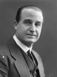 Three-quarters of a clean-shaven white man in neat morning wear