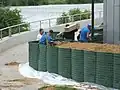 A crew installing barriers