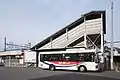 A KKJ bus at the bus stop in front of Higashi-Moro Station in March 2013