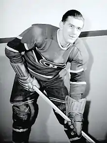 Richard poses for a photographer while wearing his full Canadiens uniform