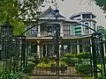 Victorian House with late 20th Century adornments added before historic zoning