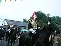 Household Cavalry parade through the village