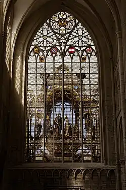 Northern transept: stained glass window by Jan Haeck after Bernard van Orley depicting Charles V (1537)